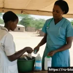 비아프라 내전 이후 재건 노력 - **A scene of hopeful recovery in a makeshift medical camp in post-war Nigeria, early 1970s.** A comp...